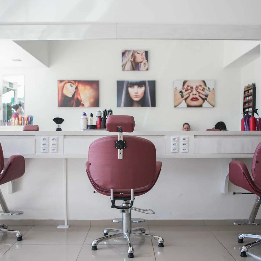 Blush styling chairs at the mirror stations